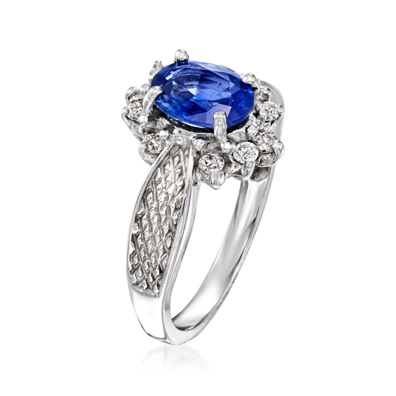 Vintage oval sapphire and diamond halo ring in 14kt white gold, textured shoulders