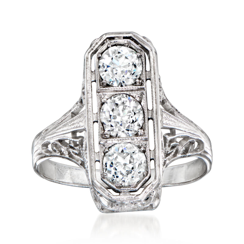 Vintage diamond filigree ring with three round stones in 18k white gold setting