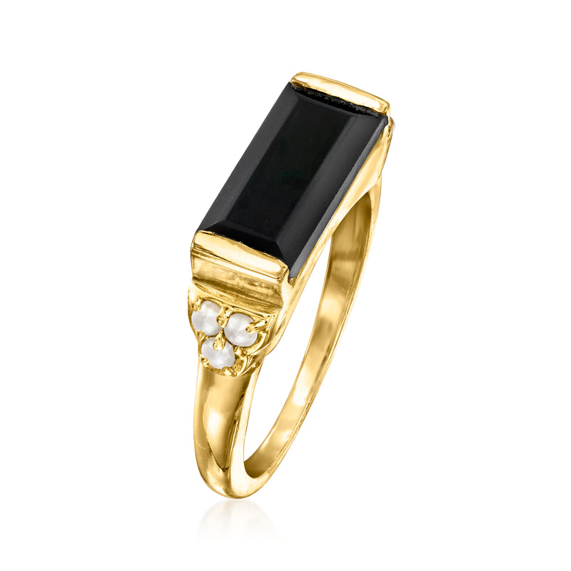 Gold ring with raised rectangular onyx and two round pearl clusters at sides