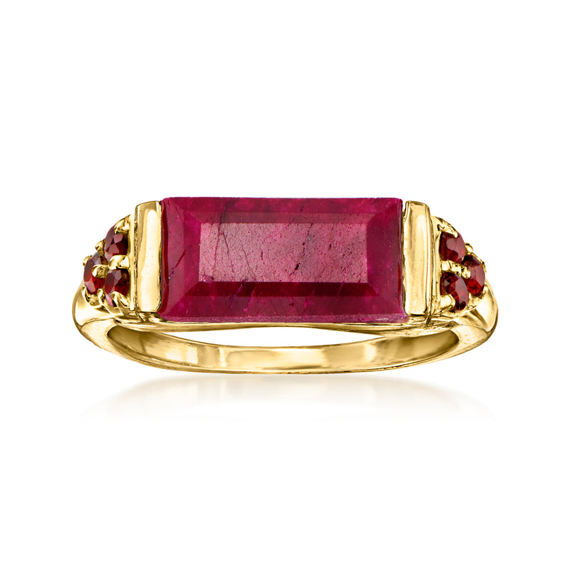 Gold ring with rectangular deep red ruby centerpiece and small garnet side accents