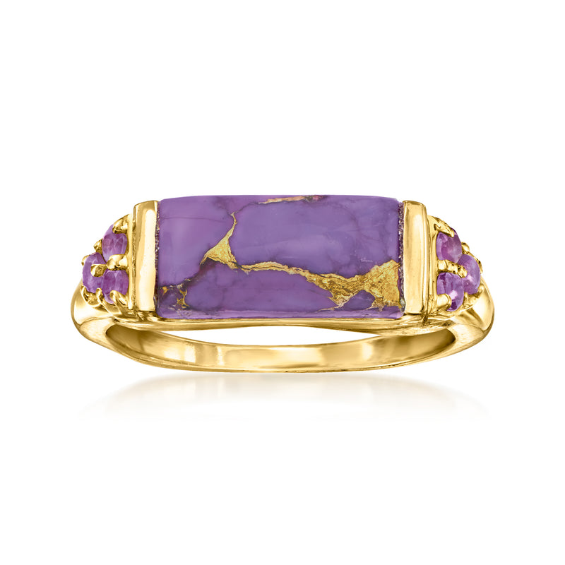 Gold ring with rectangular purple gemstone center and small purple accents on shoulders