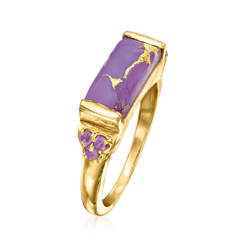Gold tone ring angled view, rectangular purple stone with round purple side stones