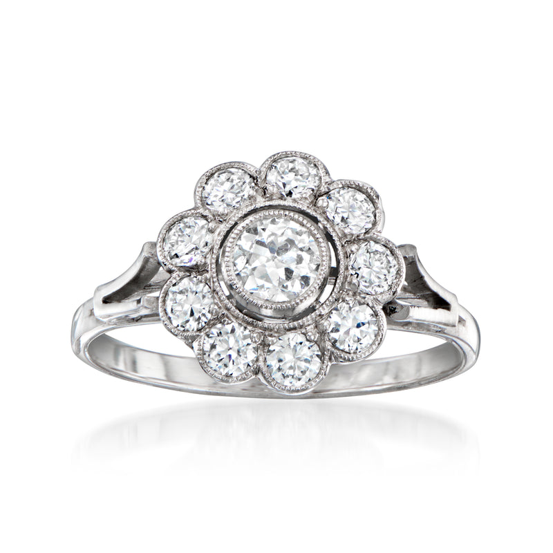 Diamond flower ring with round center stone and halo, silver-toned metal band