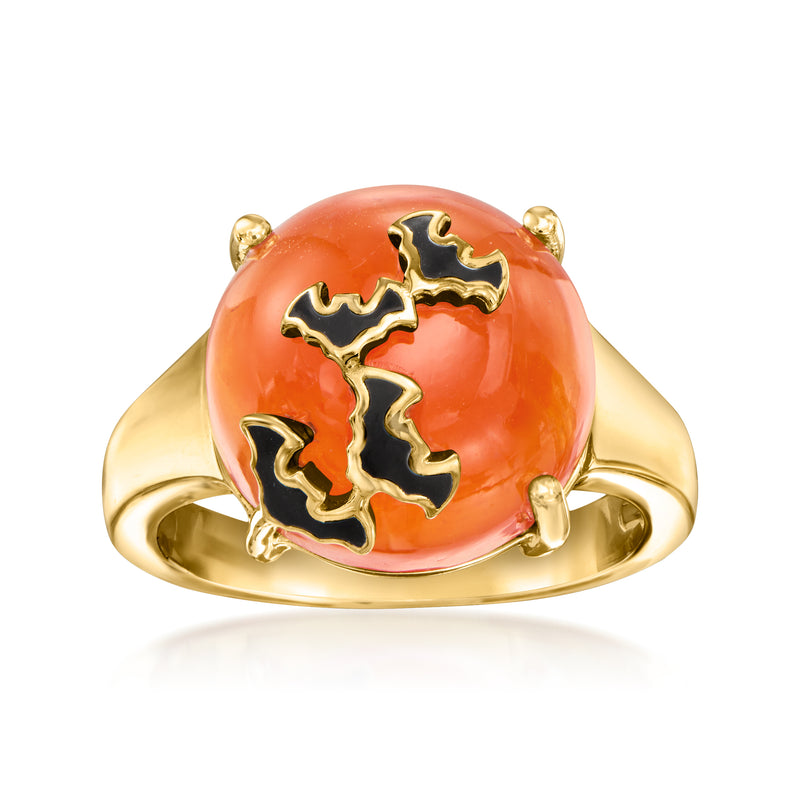 Gold bat ring with orange carnelian cabochon and black enamel bat details, rounded band.