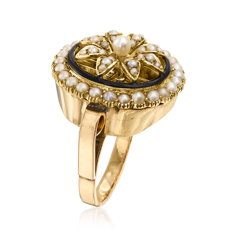 Gold ring top view with pearl border and black enamel floral medallion