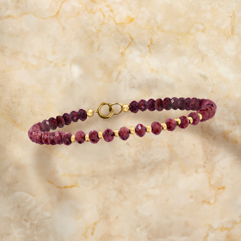 Ruby bead bracelet with maroon faceted beads and 10kt yellow gold loop clasp