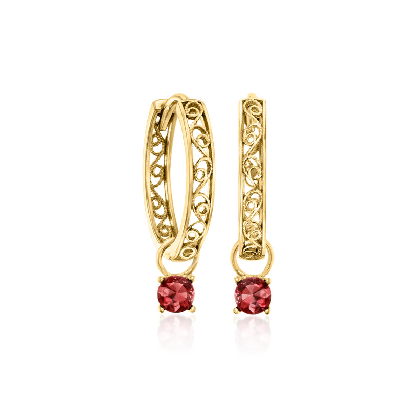 Gold hoop earrings with red gemstone drop charms in ornate oval frames