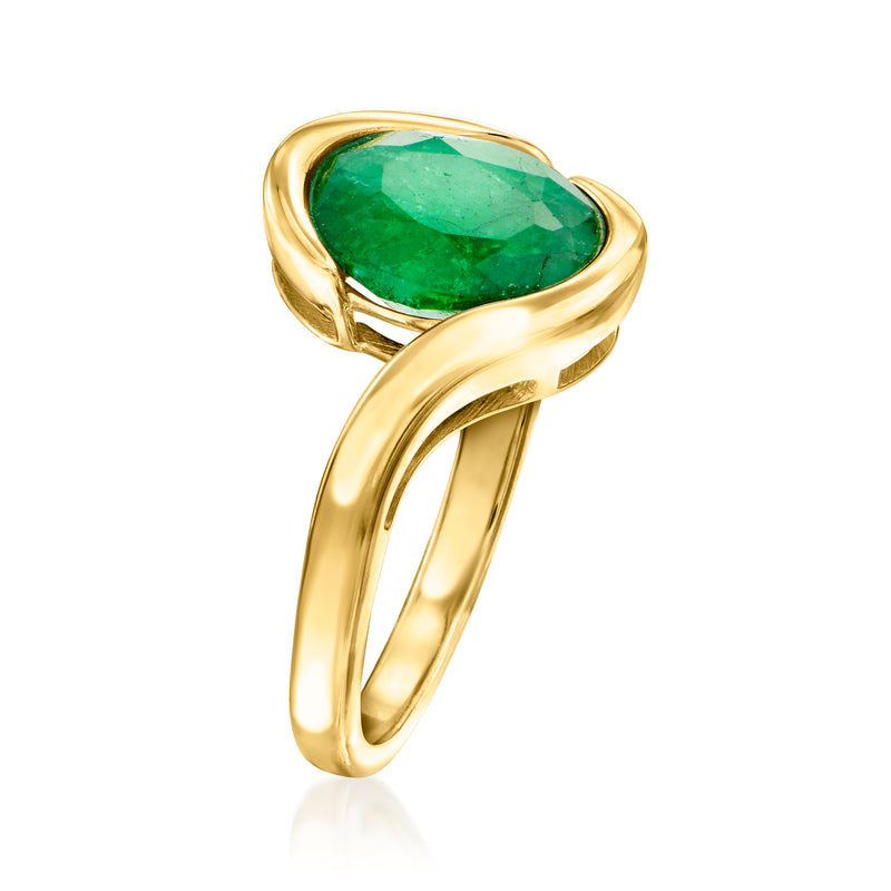 Gold swirl solitaire ring with oval green gemstone, angled side view