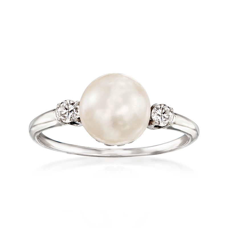 14kt white gold ring with large white cultured pearl center and two diamond accents