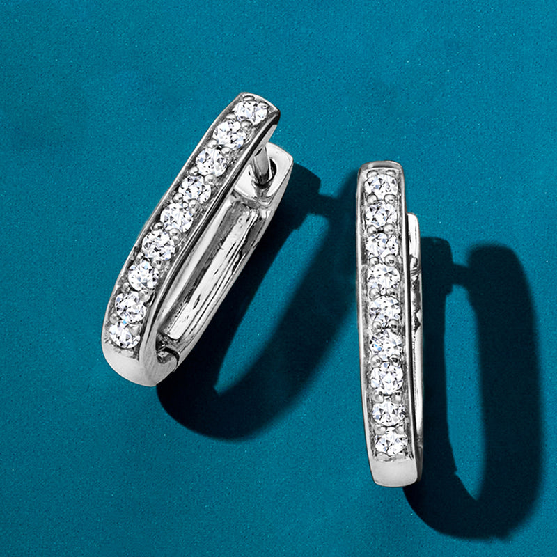 White gold hoop link earrings with clustered round-cut diamond rows, side view