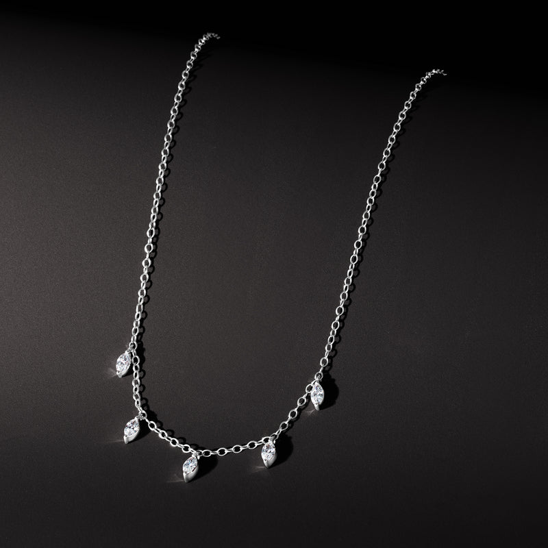 White gold station necklace with marquise-cut diamond accents along chain