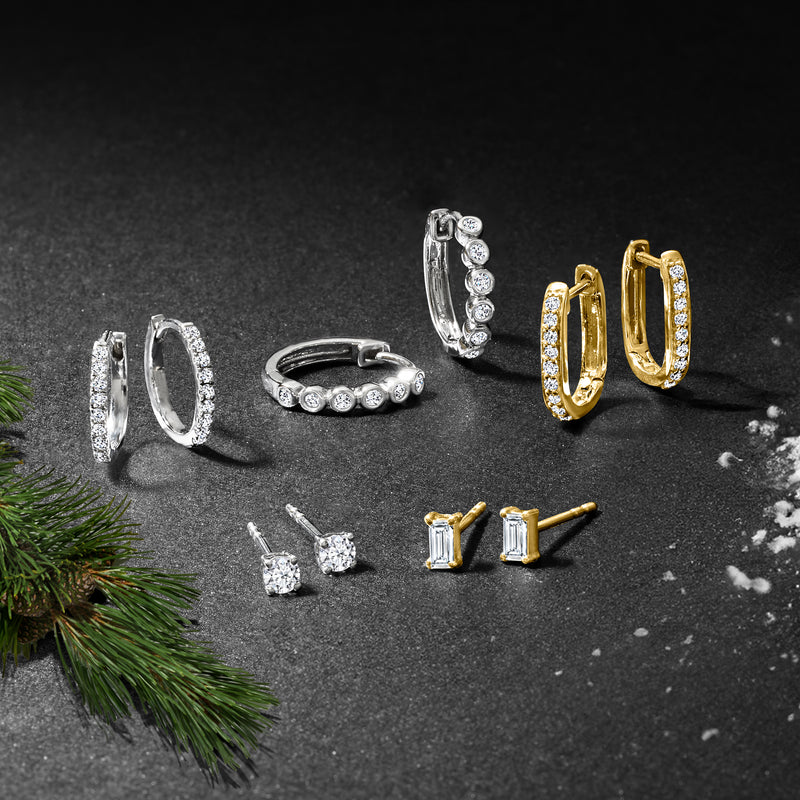 Diamond huggie hoops and diamond stud earrings with small round stones, mixed metals