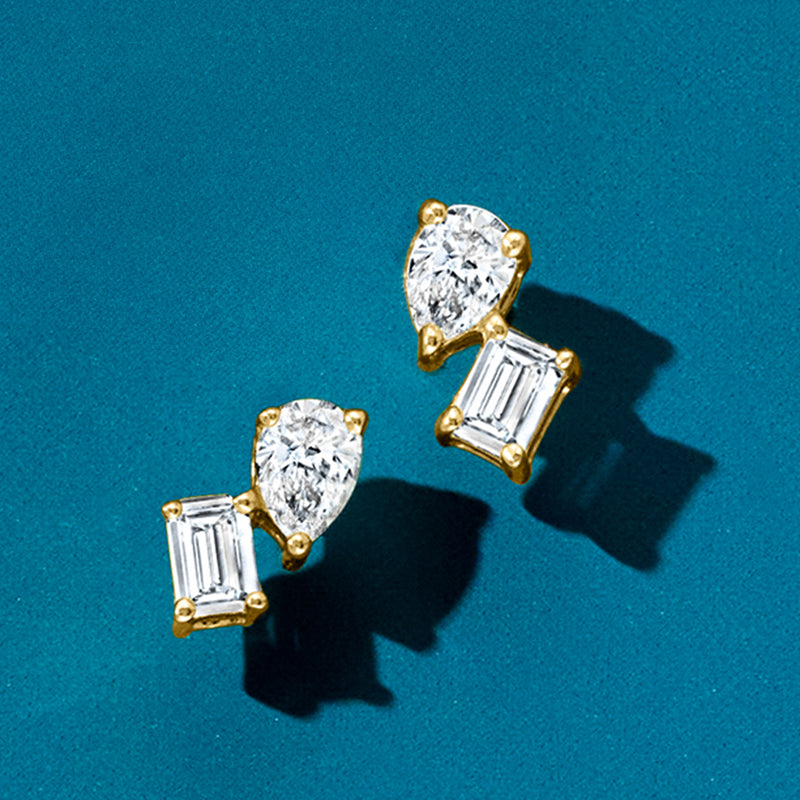 Two 14kt yellow gold toi et moi stud earrings with lab-grown round and baguette diamonds