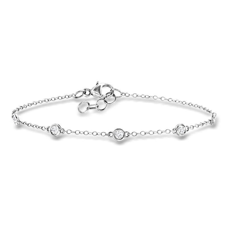 14kt white gold diamond station bracelet with four bezel-set round stones