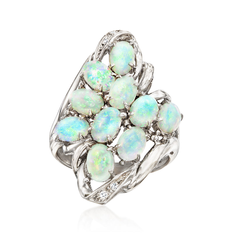 Vintage opal cluster ring with oval opals and diamond accents in silver prong setting