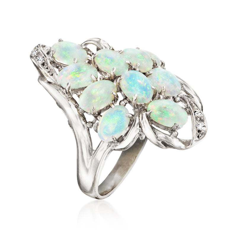 Vintage opal cluster ring with oval opals, diamond halos, and curved silver band