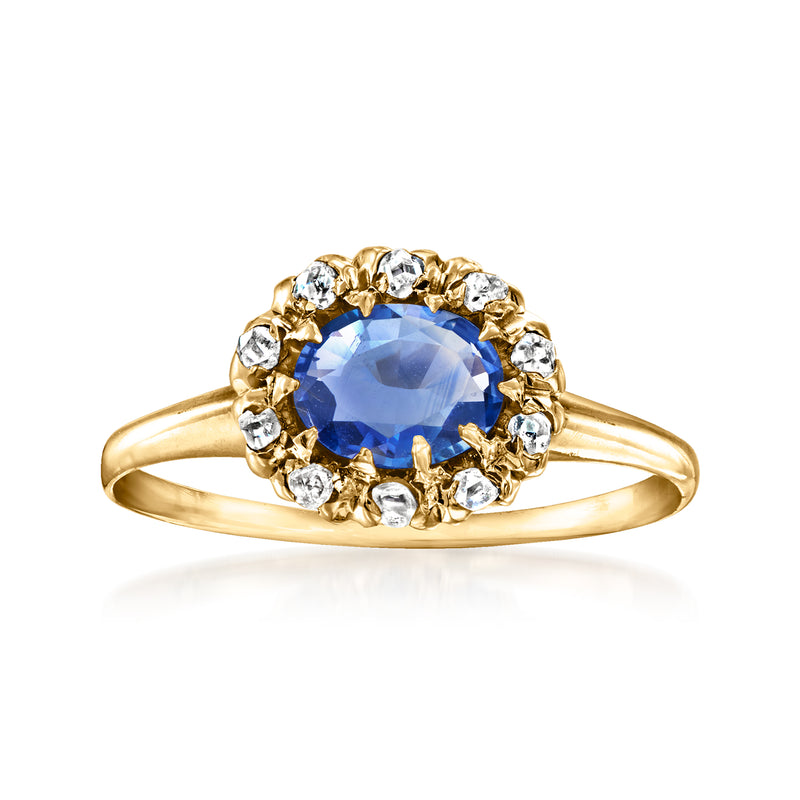 Vintage 14kt yellow gold ring with oval blue sapphire and diamond halo