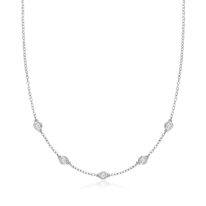 14kt white gold station necklace with small round diamonds on a fine chain