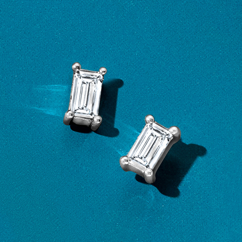 Baguette-cut diamond stud earrings in 14kt white gold, rectangular settings