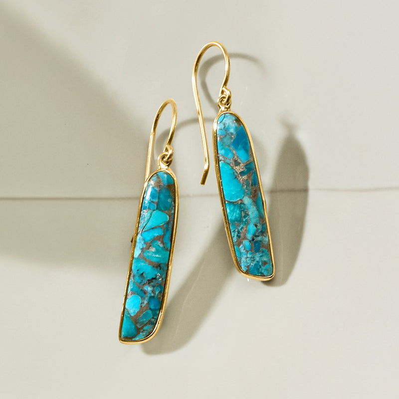 Turquoise oval drop earrings with gold over sterling earwires, dangling detail