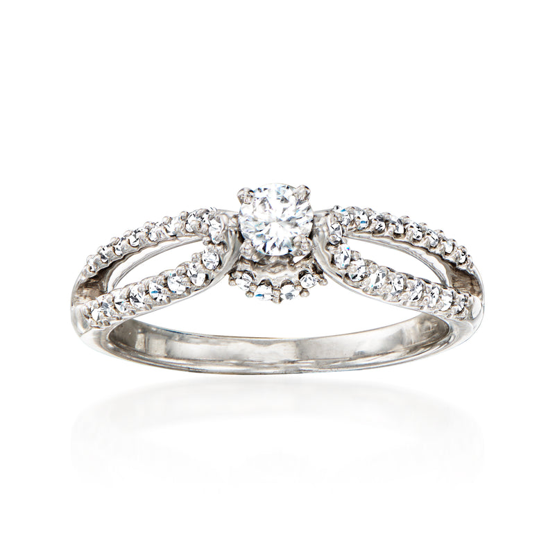 Vintage round diamond ring in 14kt white gold with halo and split shank