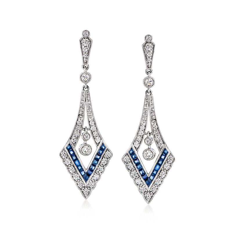Platinum drop earrings with diamond halo detailing and blue sapphire in layered fan design