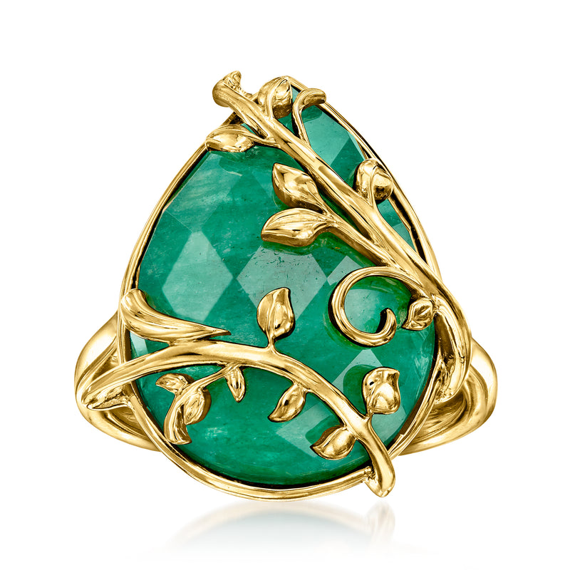 Gold vine ring with oval green gemstone and carved leaf-style metalwork