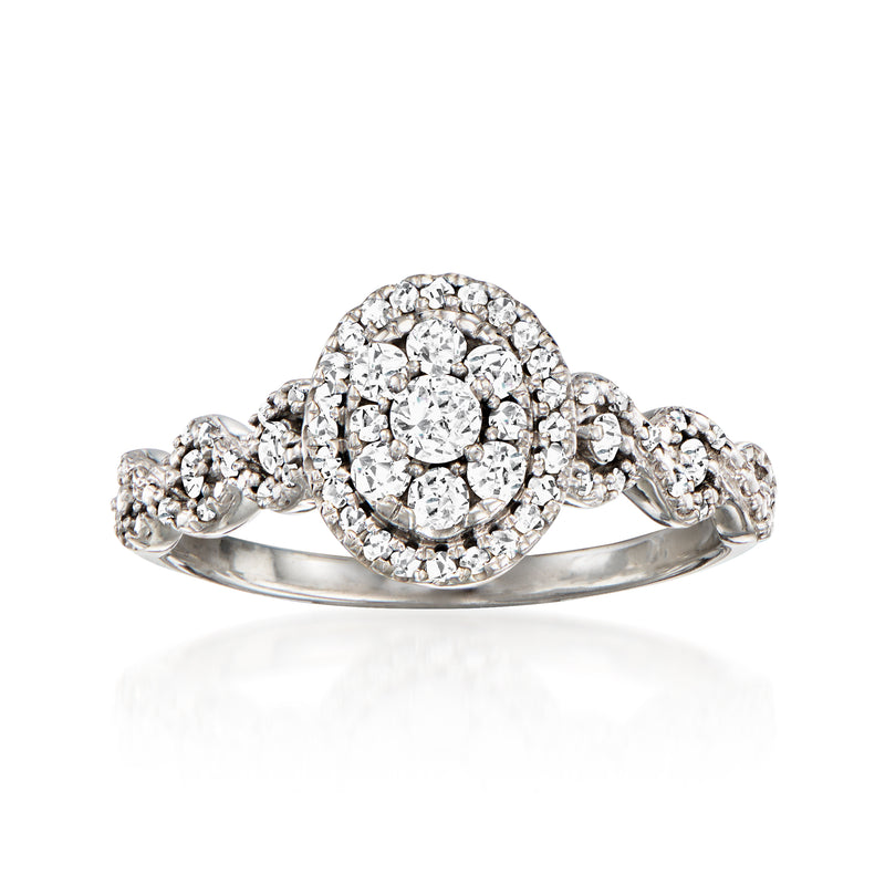 Vintage white gold diamond cluster ring with round halo and center stone