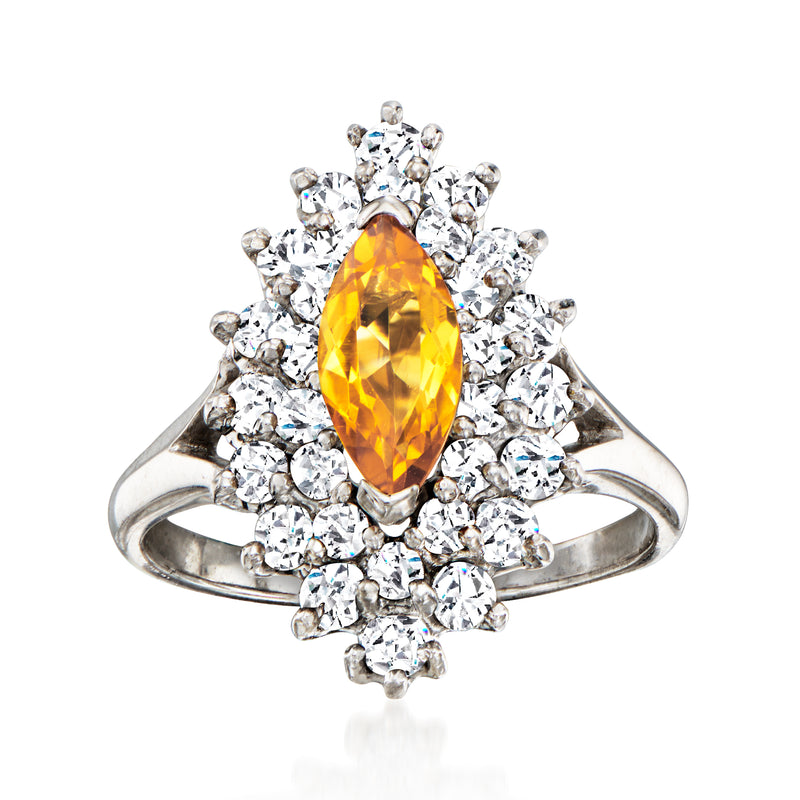 Vintage citrine and diamond ring with oval yellow citrine center and round white-gold halo