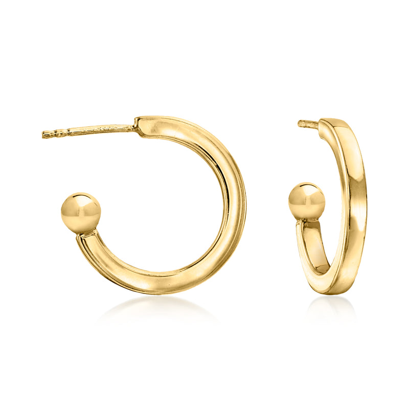Gold hoop earrings with small black onyx skull drops, angled front view.