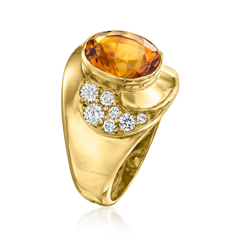 Vintage yellow gold ring with oval orange citrine and diamond clusters on the sides