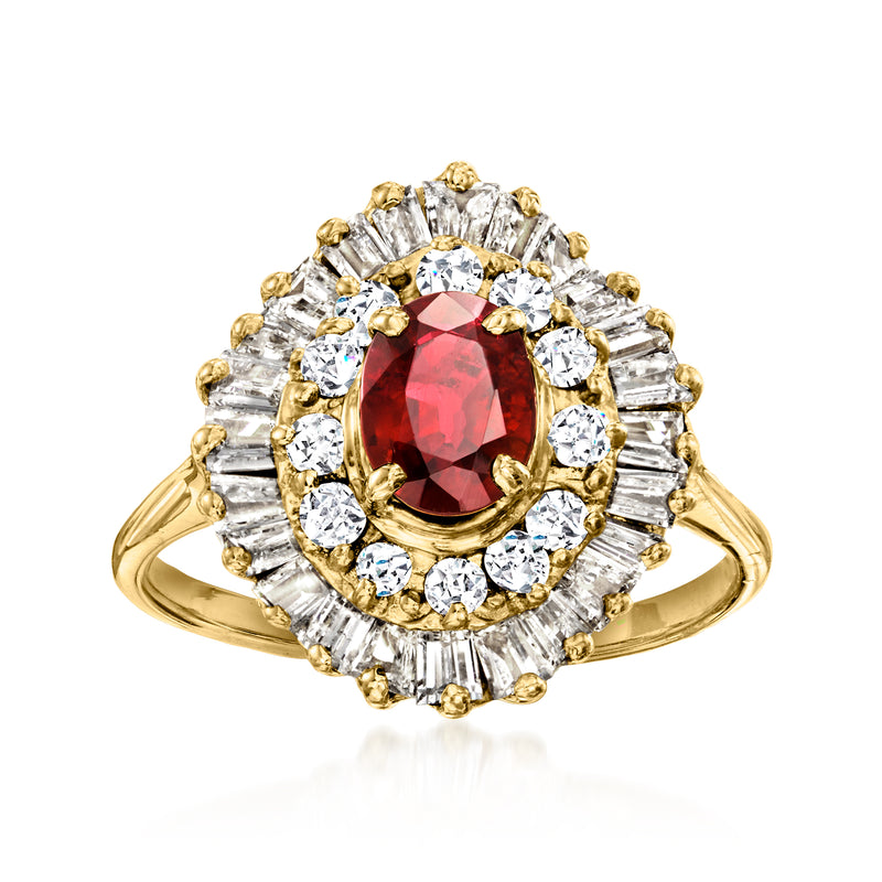 18kt yellow gold vintage ring with oval ruby center and diamond halo settings