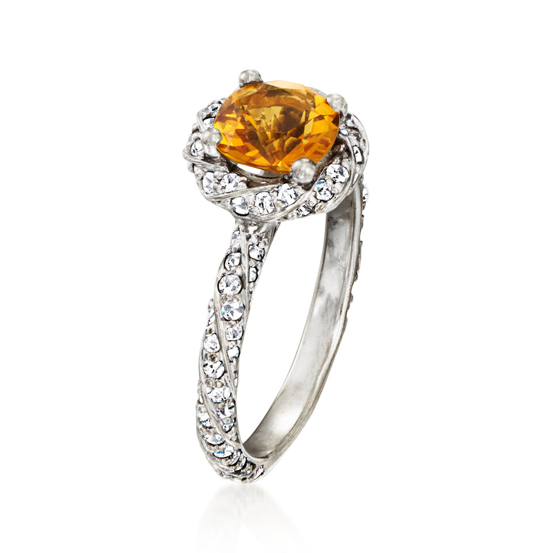 Orange citrine oval in diamond setting, ornate white gold band with side stones