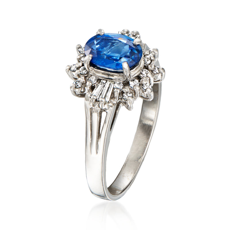 Platinum ring featuring large oval blue sapphire with surrounding diamonds