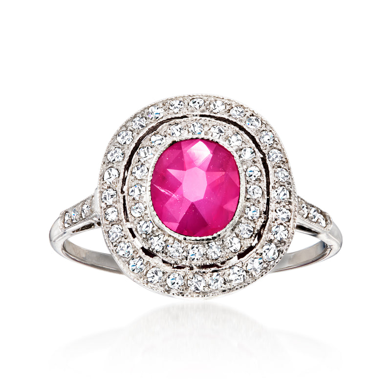 Vintage 18kt white gold ring with oval ruby center and double diamond halo