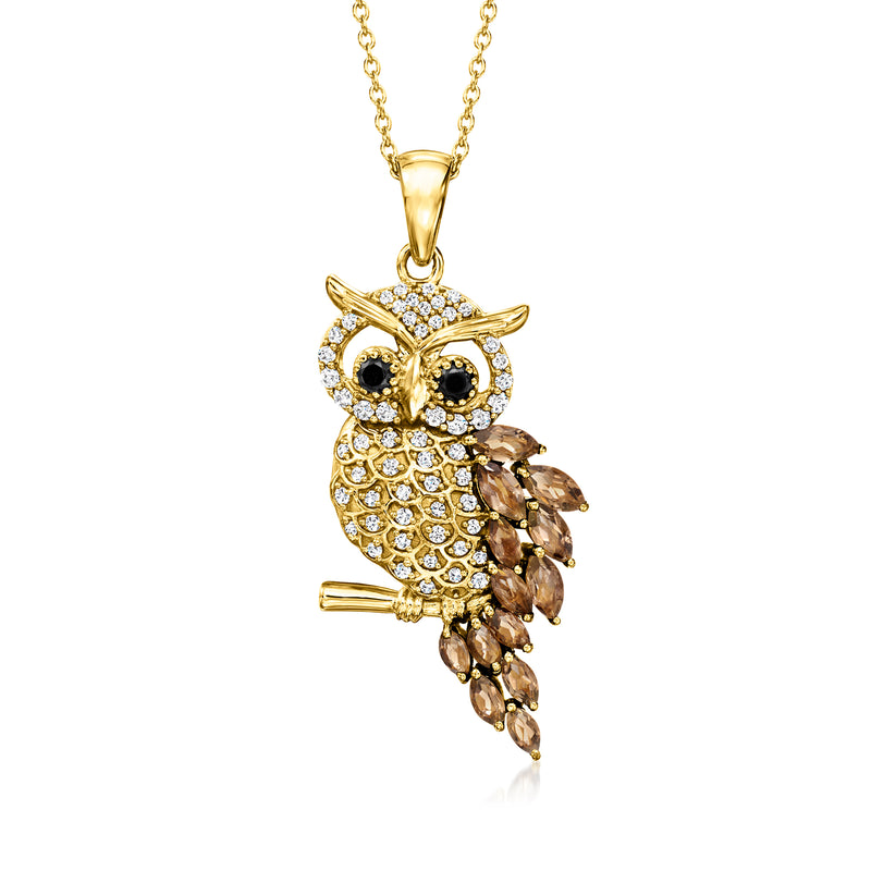 Gold owl pendant necklace with white stone details, dark eye accents, and chain