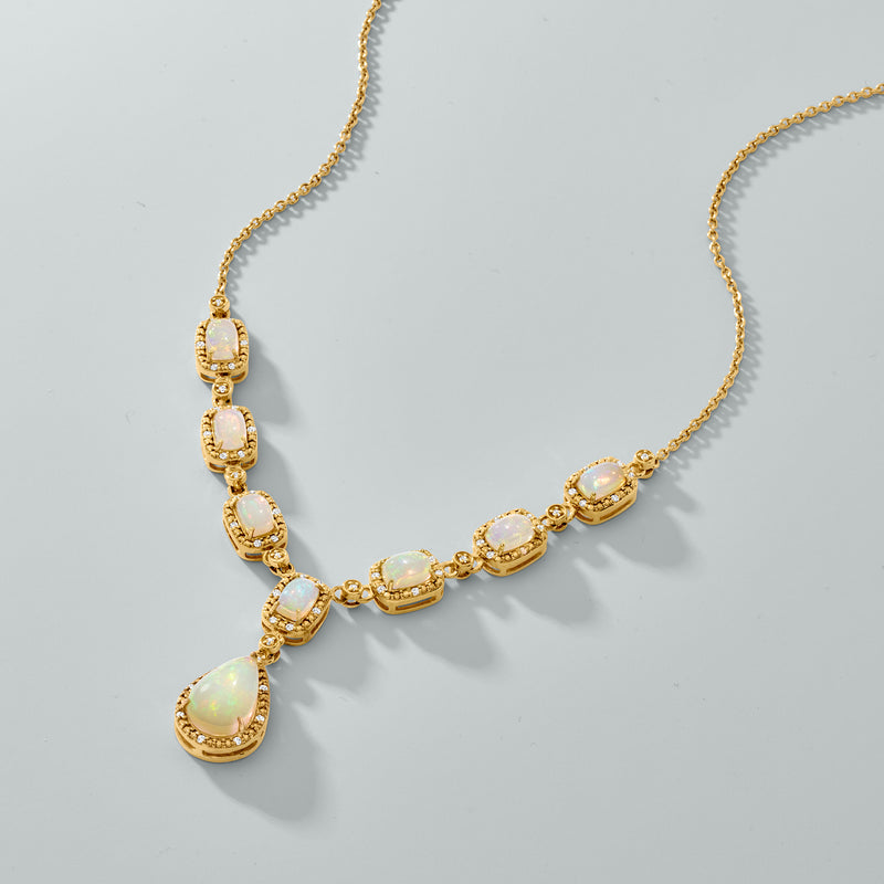 Opal-like Y-necklace featuring oval bezels and a pear-shaped center drop on gold chain