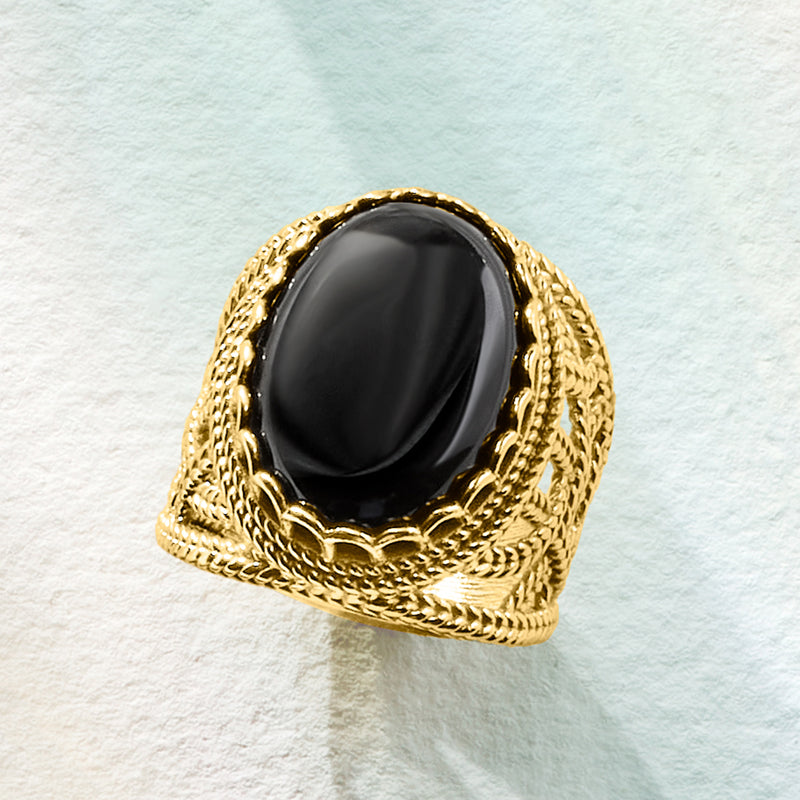 Gold-tone roped ring with oval black onyx cabochon, openwork band