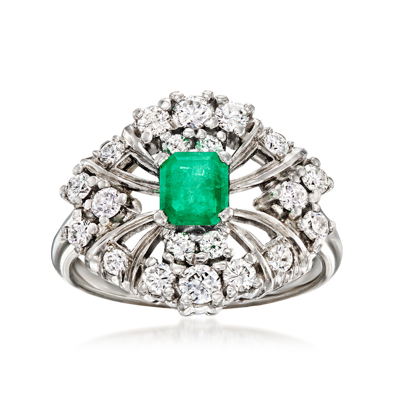 Platinum vintage ring with emerald center and diamond halo, prong-set solitaire style