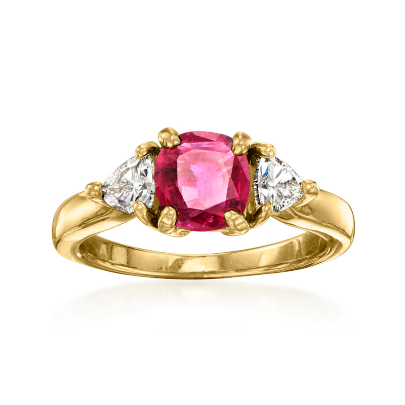 18kt yellow gold ring with oval pink ruby center and two pear-cut diamonds