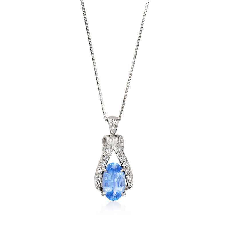 Platinum pendant necklace with oval blue sapphire and diamond halo, on chain