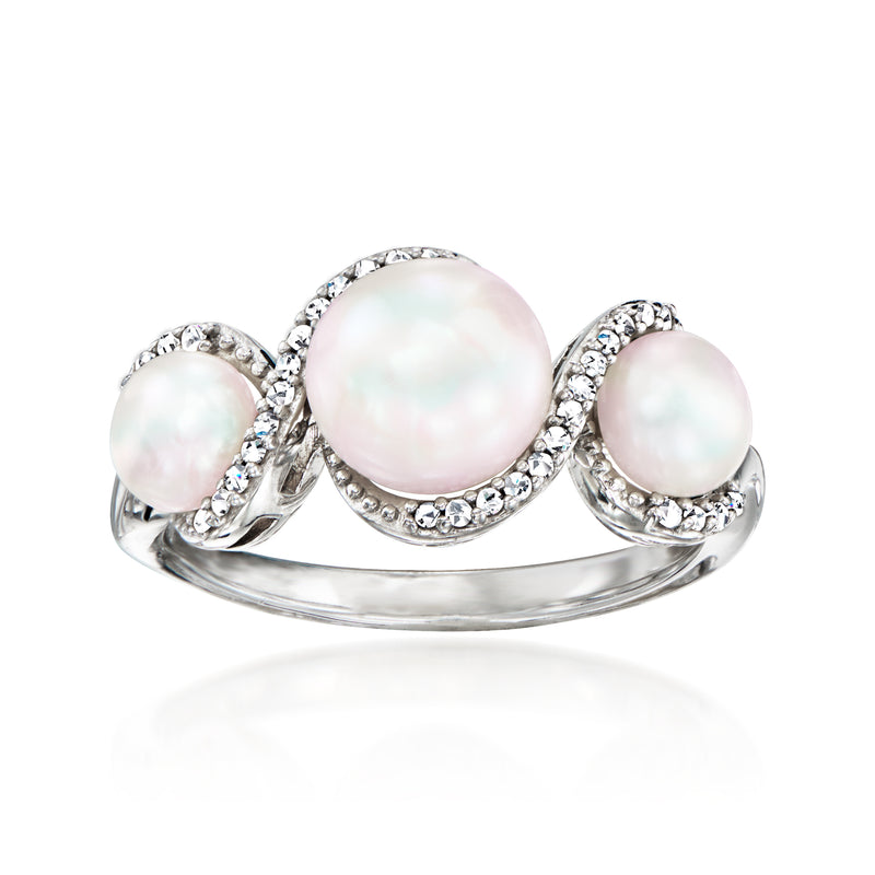 Sterling silver ring with three round pink cultured pearls and diamond accents