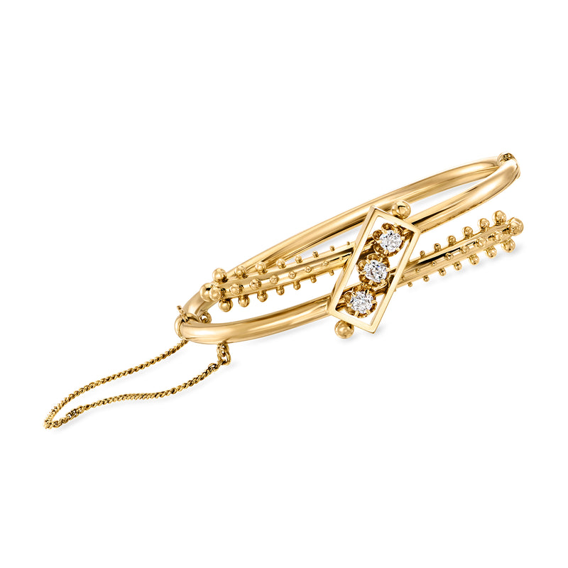 14kt yellow gold diamond bypass bangle with channel-set stones and bead accents