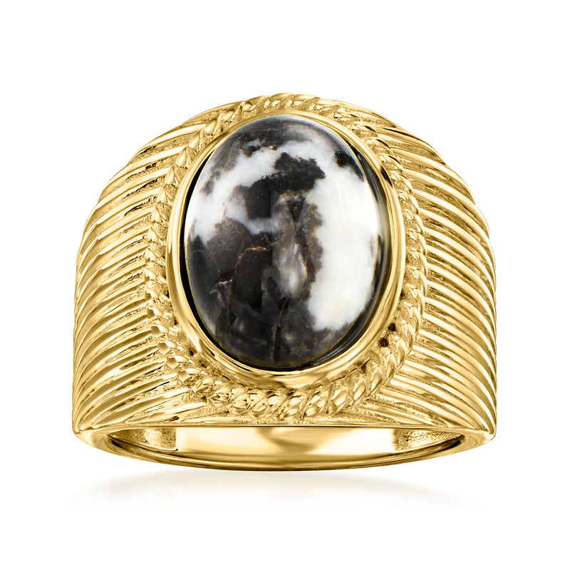 Oval marbled black-and-white gemstone ring with gold ribbed setting and bezel