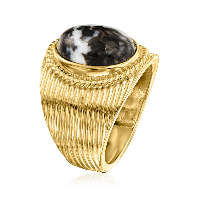Gold ribbed statement ring with oval black-and-white cabochon gemstone bezel