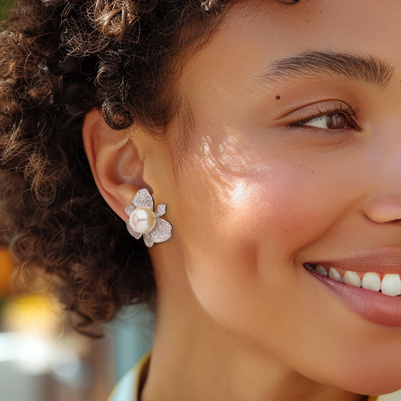 Sterling silver floral post earring with shell pearl center and CZ petals