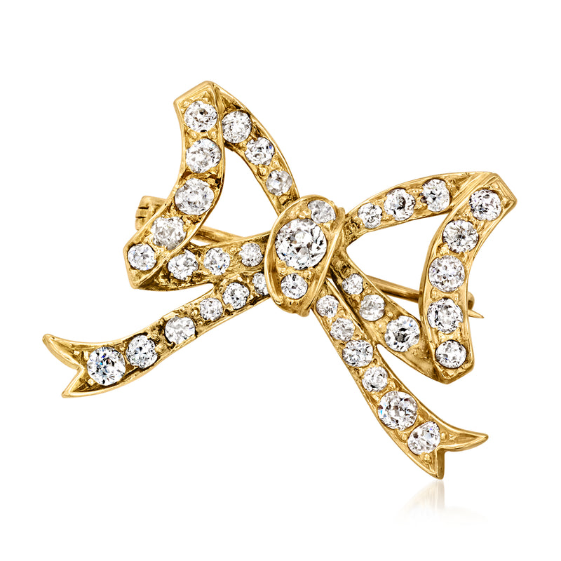 Vintage diamond bow pin in 12kt yellow gold with circular stone settings and clasp back