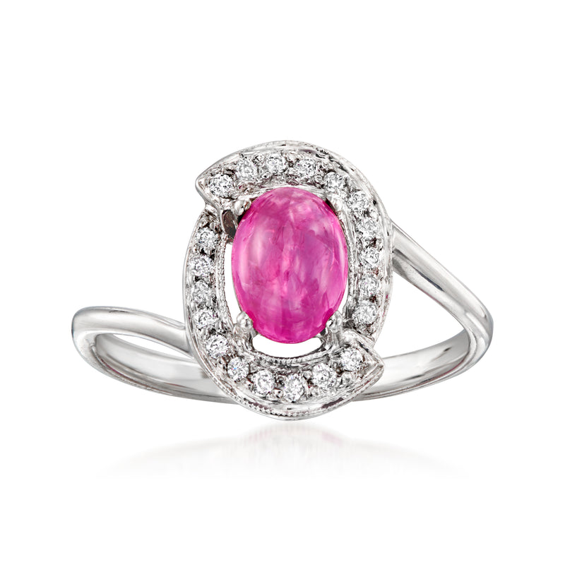 Oval pink ruby center stone diamond halo ring, white gold band