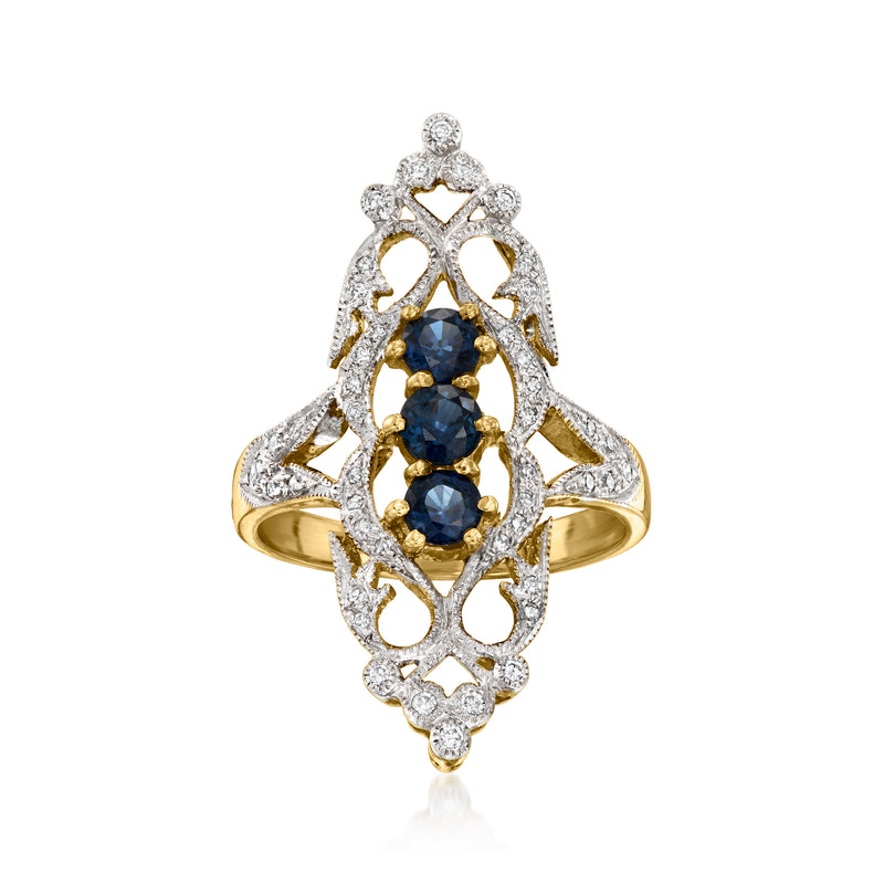 18k yellow gold vintage dinner ring with blue sapphire center and diamond halo