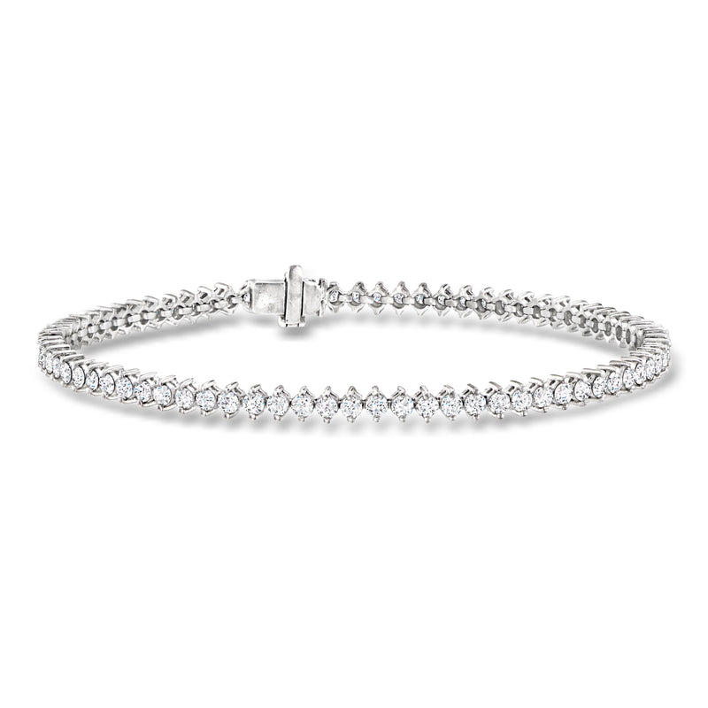 Platinum diamond tennis bracelet with linked stones and hinged clasp